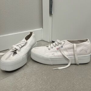 Superga platform white tennis shoes.